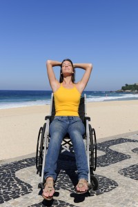 woman in wheelchair enjoying outdoors beach