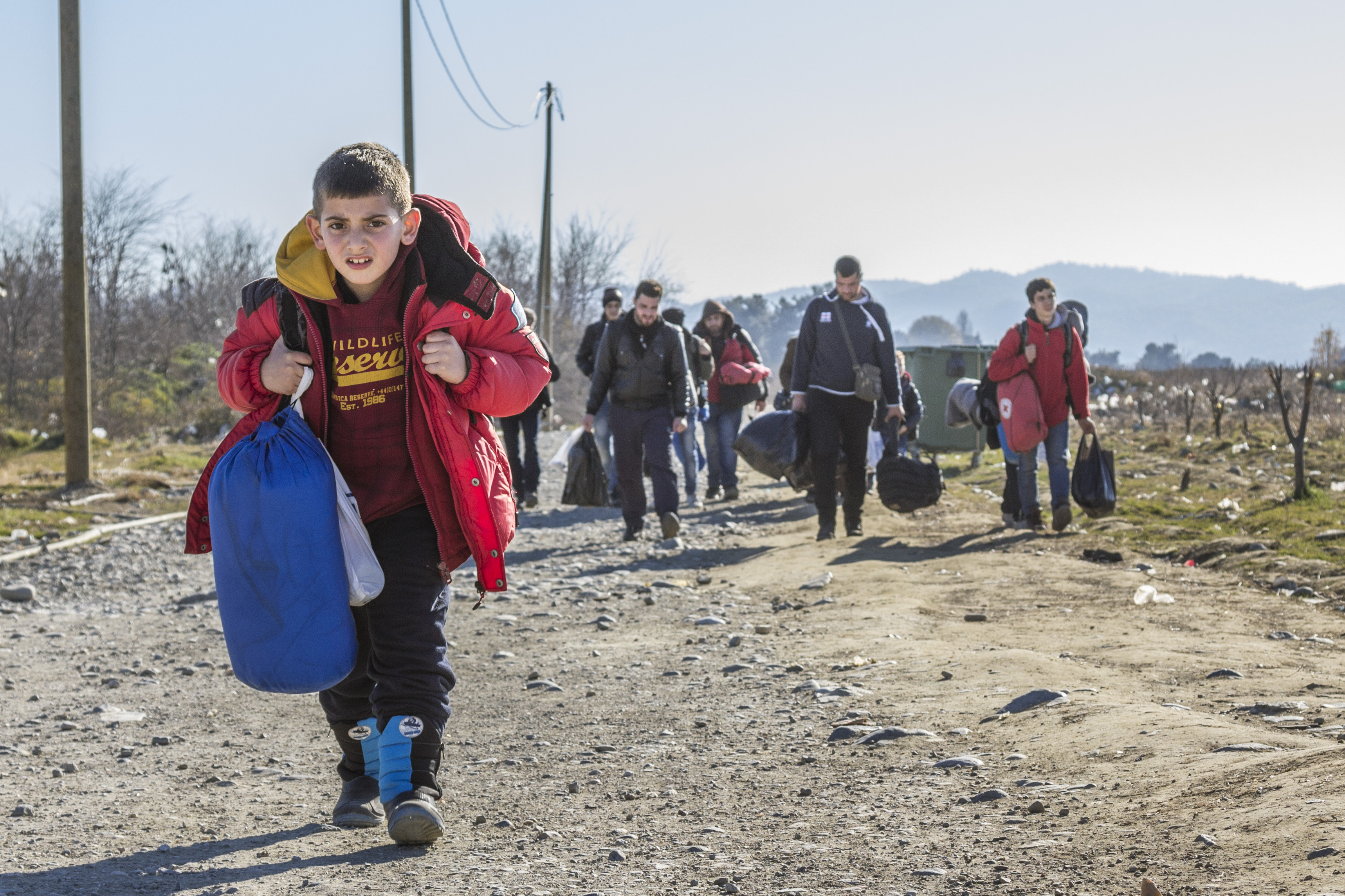 Gevgelija, Macedonia - December 23, 2015: Refugees arriving at the refugee camp of Vinojug in Gevgelija (Macedonia) after having crossed the border with Greece at Eidomeni.